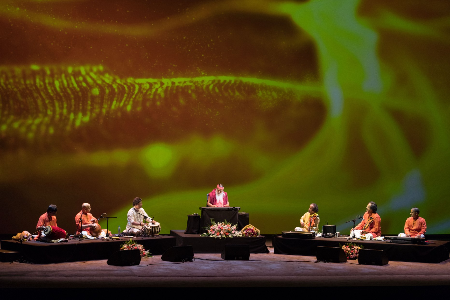 Healing Music Experience — Sri Swamiji with ensemble, green nature backdrop