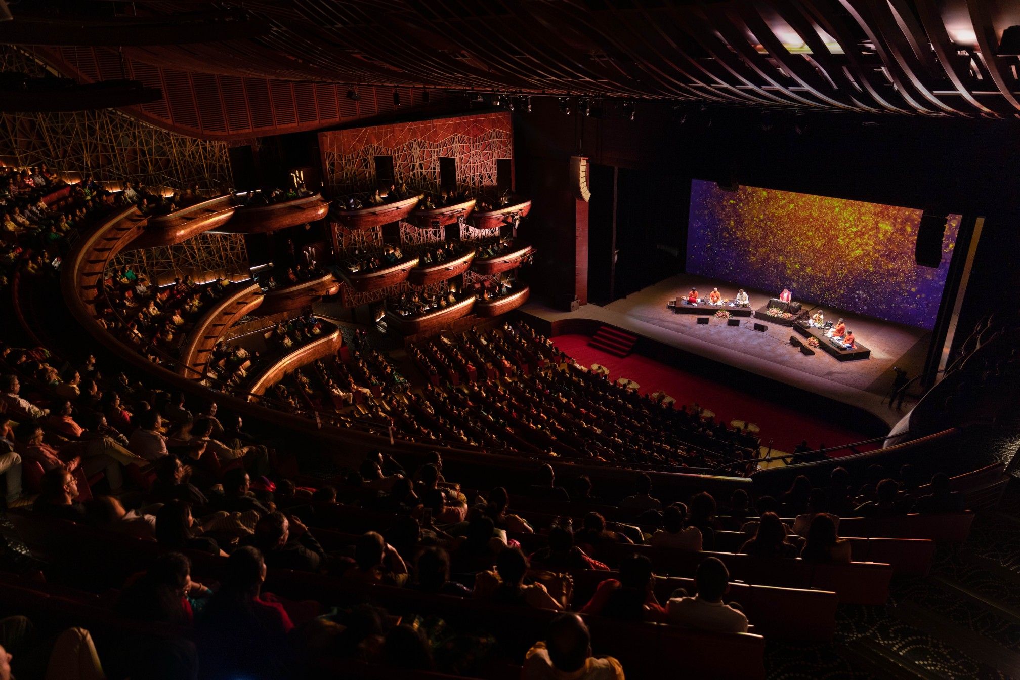 Healing Music Experience hall — aerial view of stage and audience
